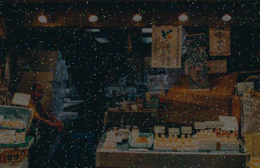 Hot Pixel Noise, applied to “Elderly street vendor (Unsplash)”