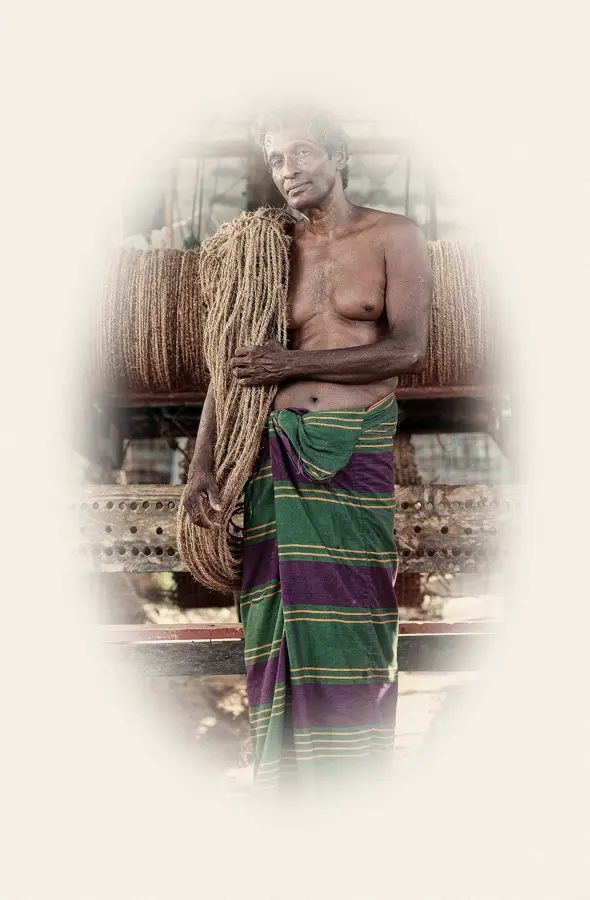 Portrait Vignette, applied to “Traditional worker with coconut rope (edited)”